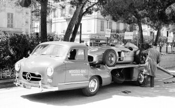 Mercedes-Benz high-speed racing car transporter “The Blue Wonder” with a Formula One racing car W 196 R with free-standing wheels in the loading area.