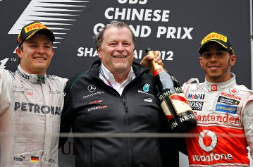 Nico Rosberg, Norbert Haug and Lewis Hamilton on the podium at the 2012 Chinese Grand Prix. It was the first victory for Mercedes-Benz since the brand returned to Formula One in 2010. 