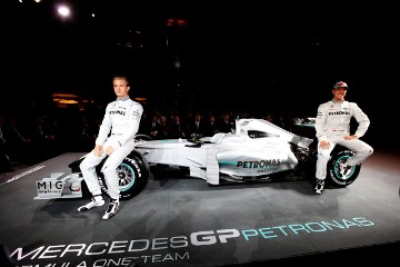 Michael Schumacher and Nico Rosberg at the launch of the first modern-day Mercedes F1 car in 2010 in Stuttgart, Germany. 